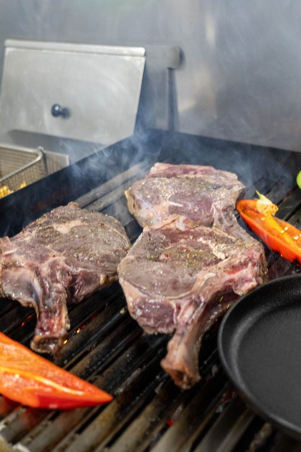 Steaks being prepared on the grill